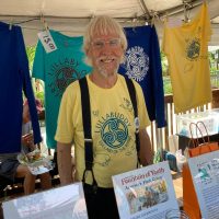 Gallery 1 - One of the founders and organizers, Bob Patterson in Lullaby of the Rivers Festival Shirt.