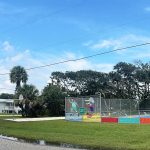 Gallery 1 - Fence Mural located next to tennis courts in Vilano Beach. Team of doubles plays tennis.