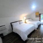 Gallery 6 - Historic Zora Neale Hurston Home Suite with double beds available to guests.