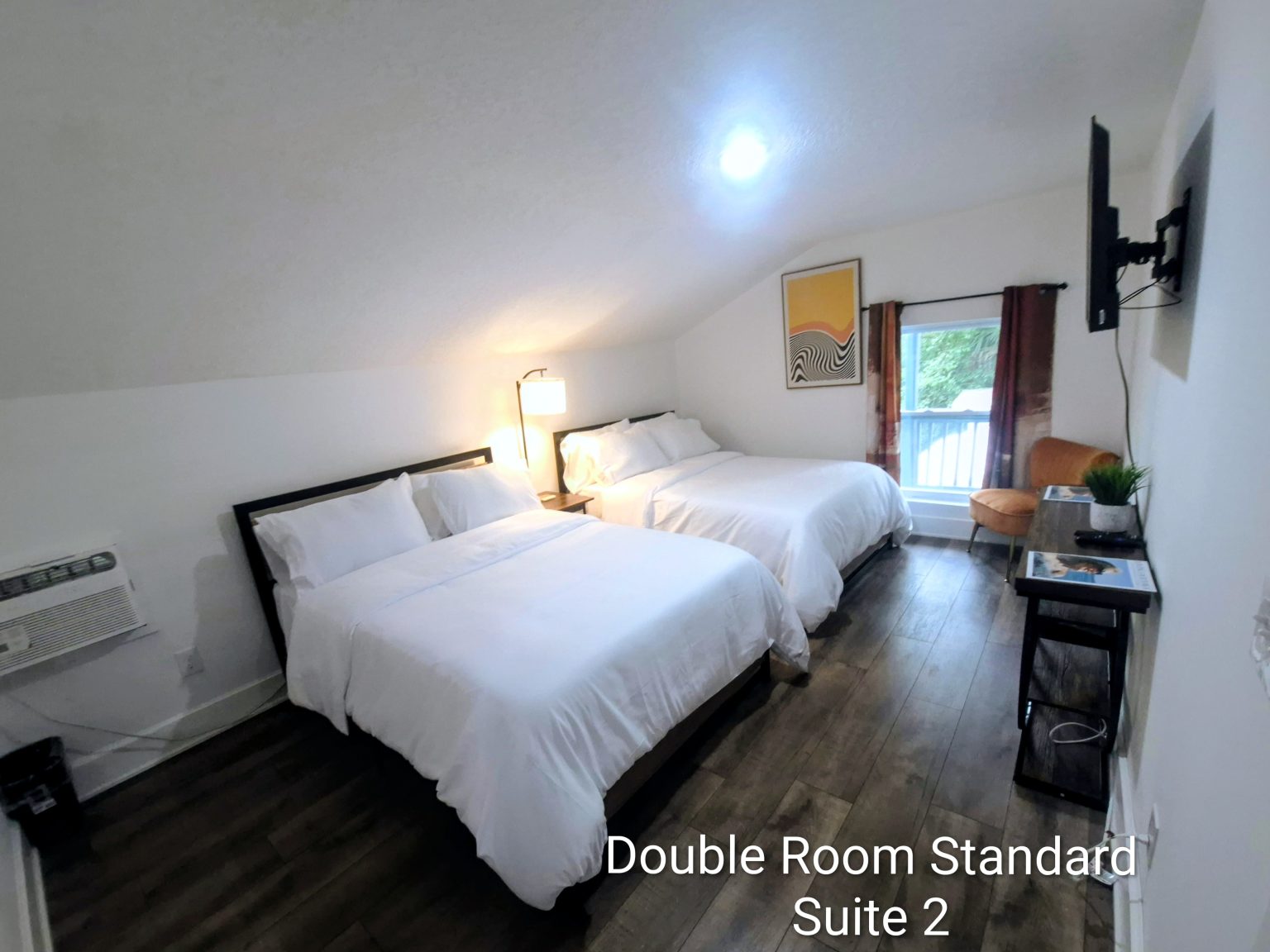 Gallery 6 - Historic Zora Neale Hurston Home Suite with double beds available to guests.