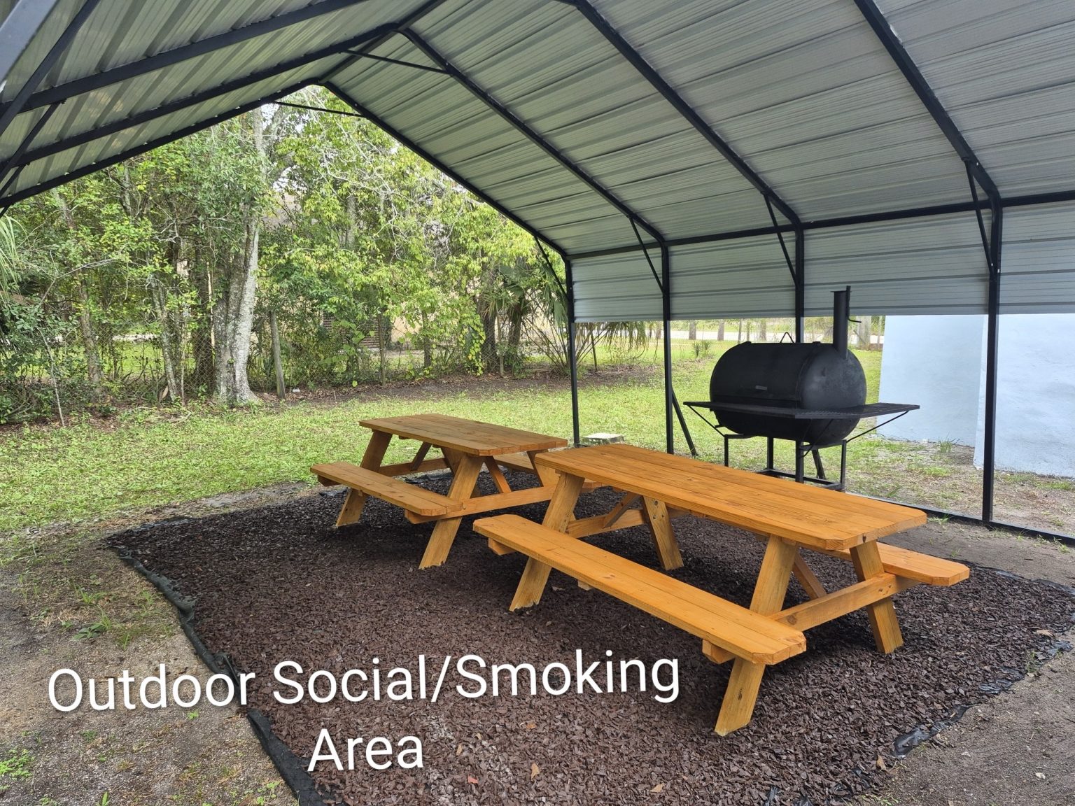 Gallery 10 - Covered outdoor area with picnic table and smoker.